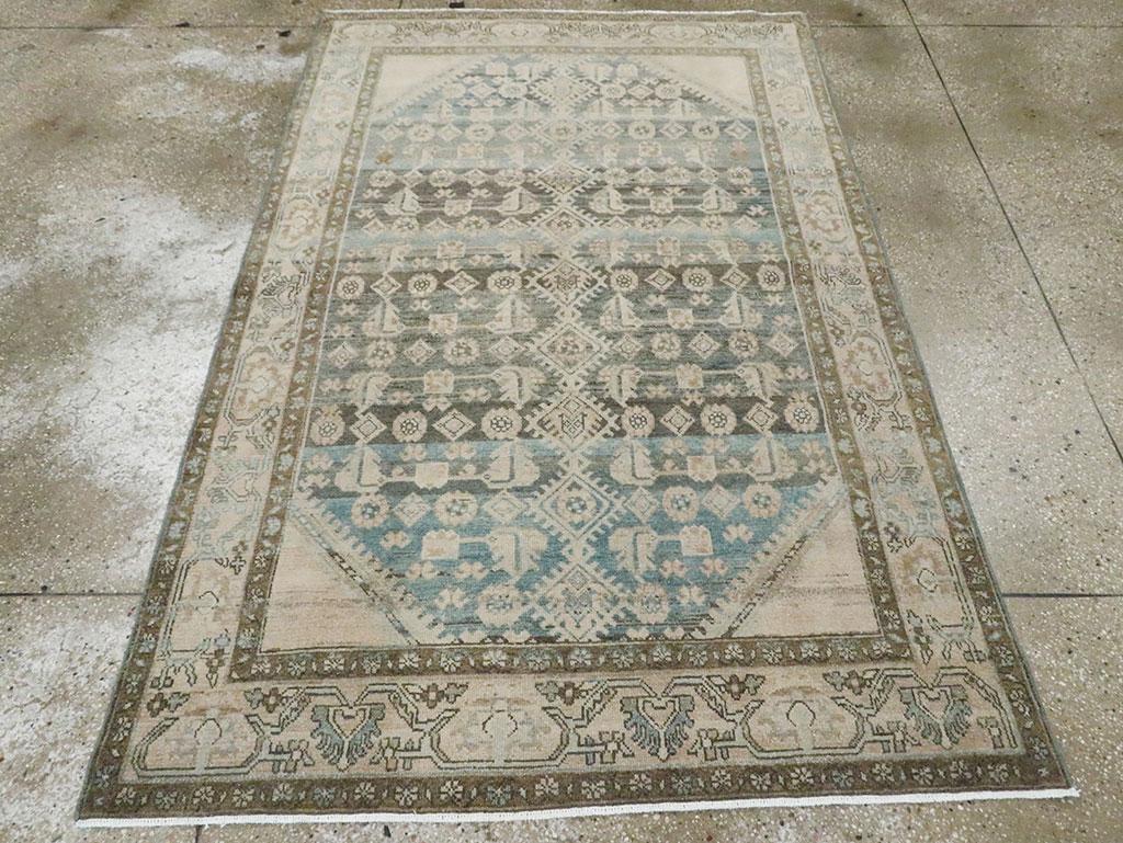 A vintage Persian Malayer accent rug handmade during the Mid-20th century.

Measures: 4' 5