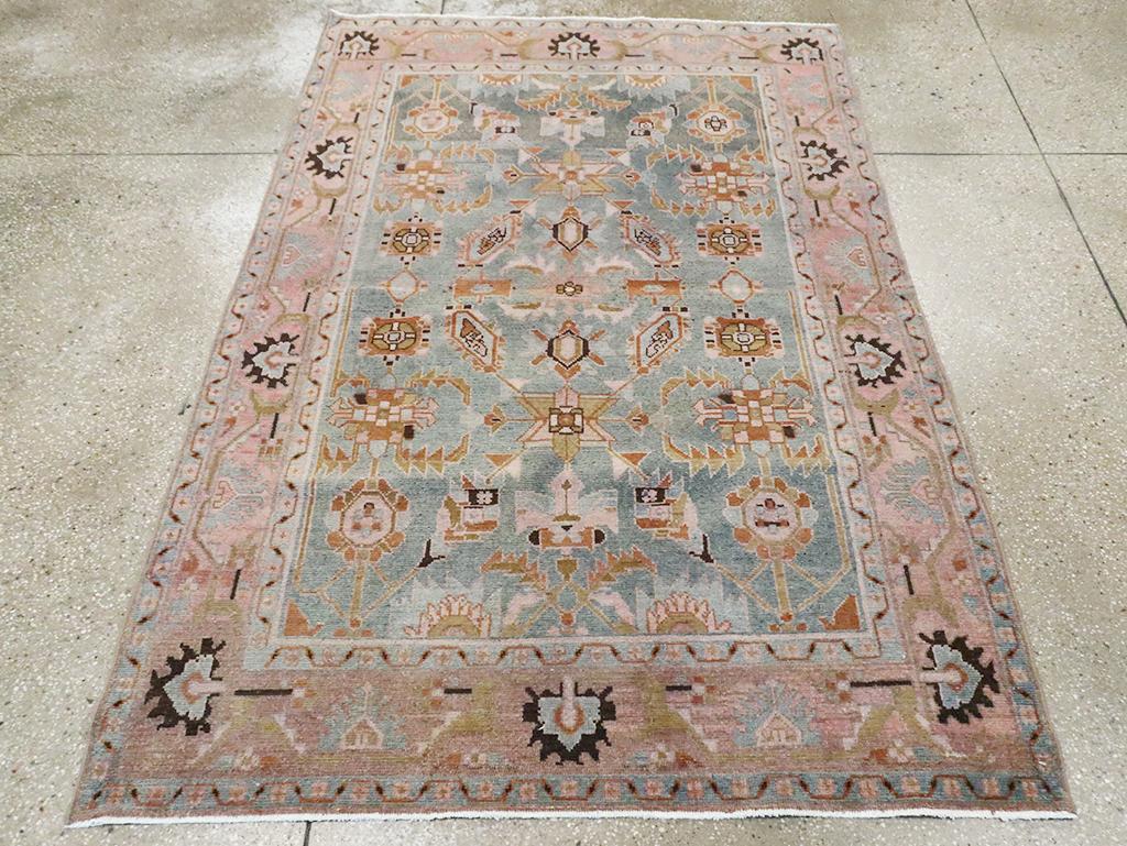 A vintage Persian Malayer accent rug handmade during the Mid-20th century.

Measures: 4' 6