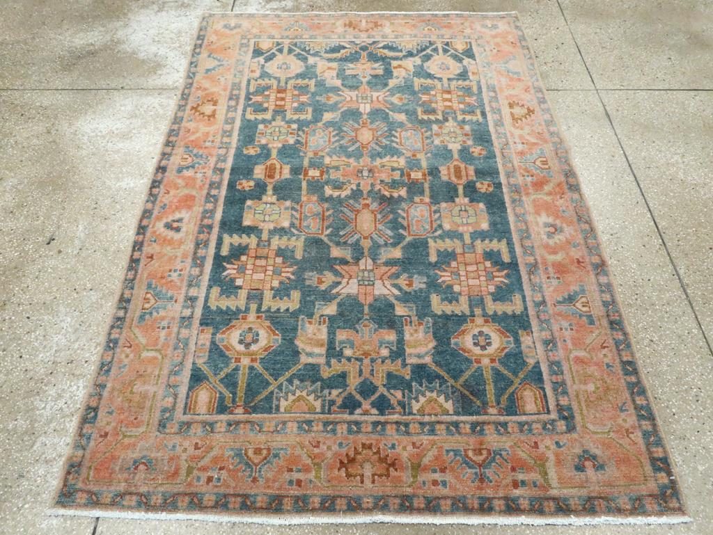 A vintage Persian Malayer accent rug handmade during the Mid-20th century.

Measures: 4' 6