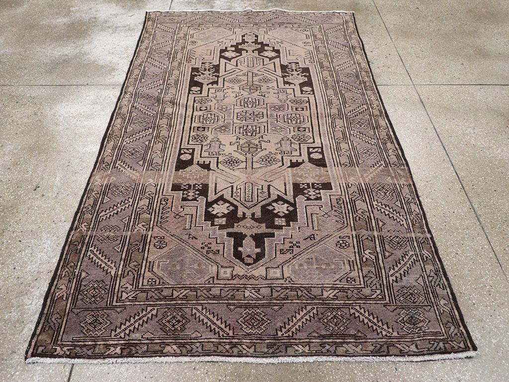 A wool pile of symmetric knots on a cotton foundation. Two abrashes run fully across the sand field and over the near-black stepped cartouche medallion, which features four large human figures. Geometric coiled leaf corners. A powder grey