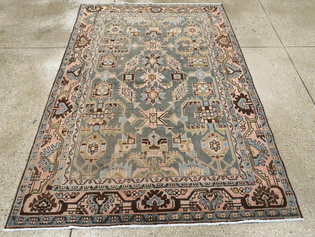 A vintage Persian Malayer accent rug handmade during the Mid-20th century.

Measures: 4' 7