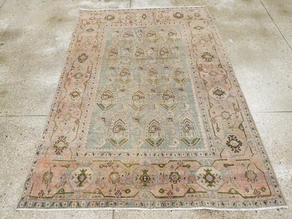 A vintage Persian Malayer accent rug handmade during the Mid-20th century.

Measures: 4' 7