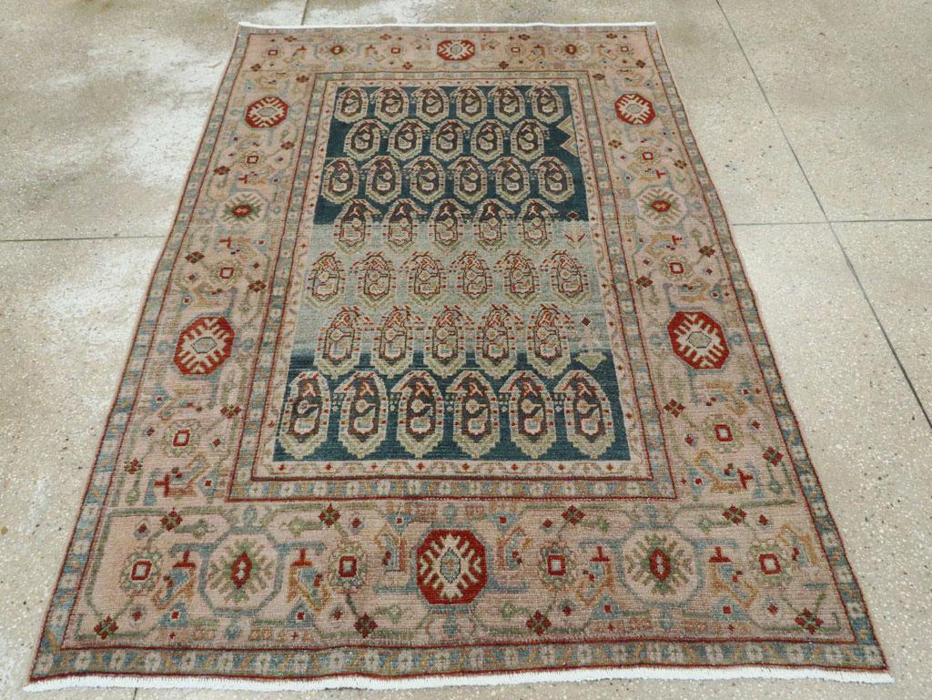 A vintage Persian Malayer accent rug handmade during the Mid-20th century.

Measures: 4' 7