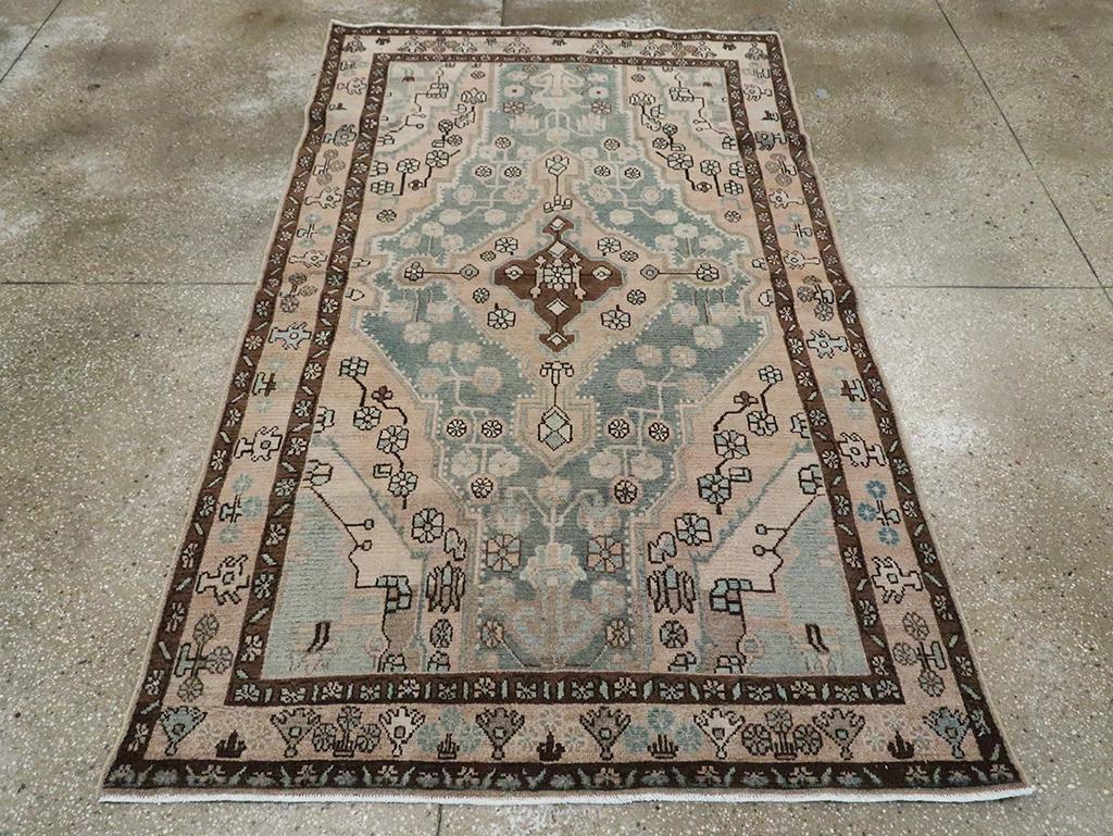 A vintage Persian Malayer accent rug handmade during the Mid-20th century.

Measures: 4' 7