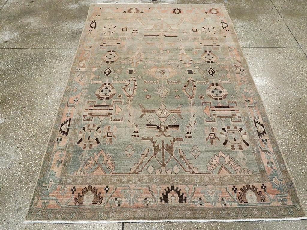 A vintage Persian Malayer accent rug handmade during the Mid-20th century.

Measures: 4' 8