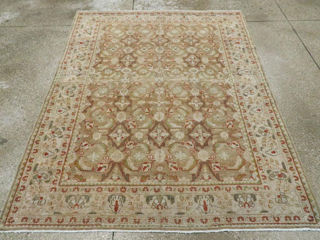 A vintage Persian Malayer accent rug. The dark open diamonds of this Herati design have additional projections and nodules, all on the rust brown field. This west Persian scatter features a sand main border with short cypress-like shrubs, palmettes