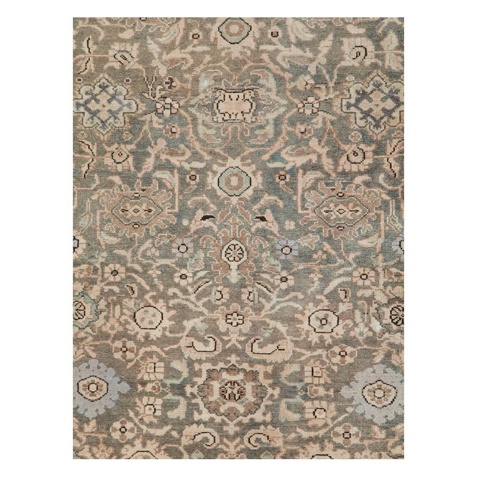 A vintage Persian Malayer room size carpet in square format handmade during the mid-20th century. The khaki green and khaki brown field is decorated with cream floral elements. The border has large brown palmettes connected by an acanthus scroll