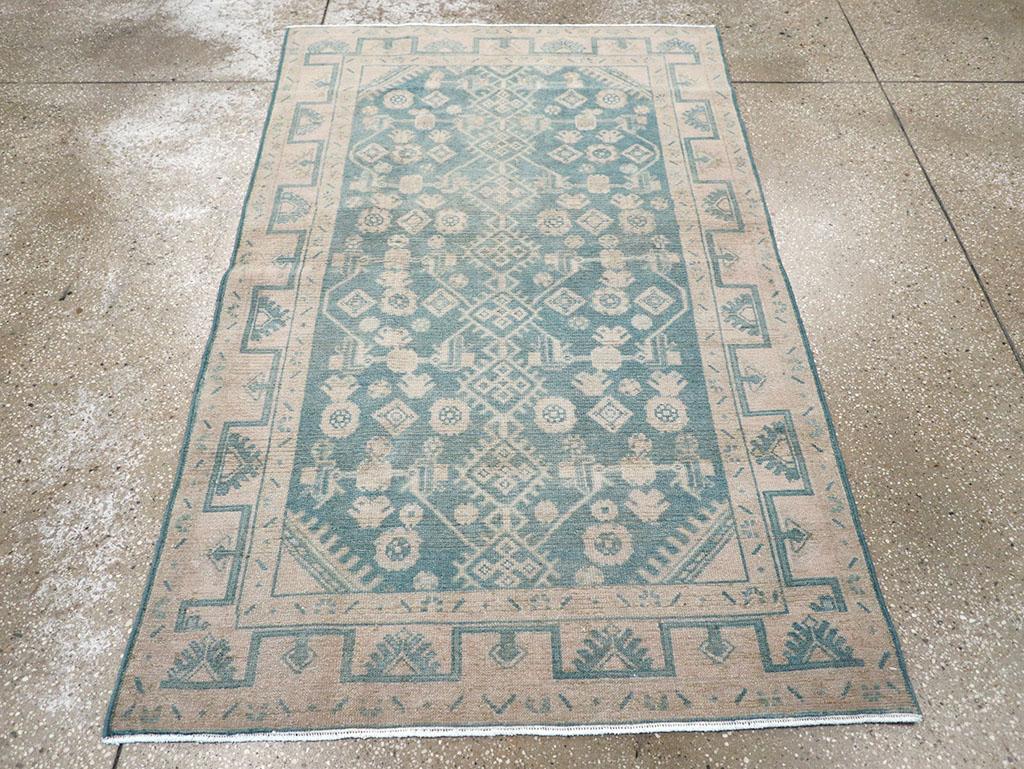 A wool pile of symmetric knots on a cotton foundation. A loosely interpreted Herati pattern is organized around a full-length pole of fringed diamonds, accompanied by bent leaves, various rosettes, and simplified palmettes in the lateral reserves.