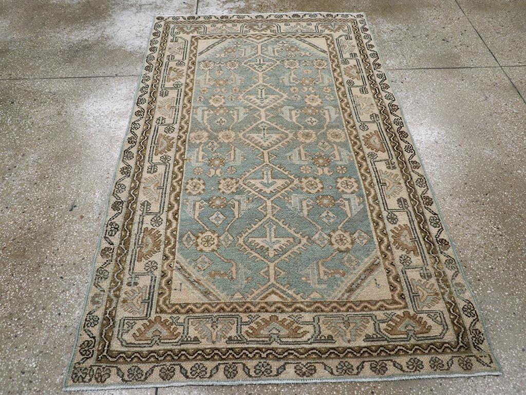 A wool pile of symmetric knots on a cotton foundation. This minimalist rendition of a local Malayer interpretation of the Herati design features a central column of joined diamonds, each enclosing a triangular palmette. Widely spaced rosettes and