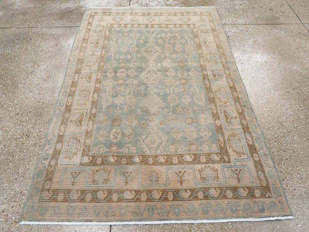 A wool pile of symmetric knots on a cotton foundation. Coarsely woven, this village scatter rug features a Herati variant with a central axis of connected fringed lozenges, flanked by leaves, lozenges, and rosettes. The main straw strip-style border