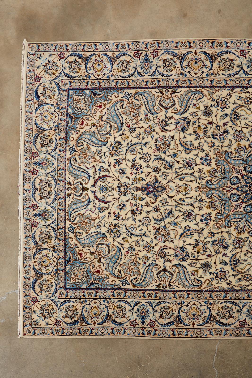 Fantastic example of a Classic Persian Nain rug featuring a densely knotted wool with silk and a cotton warp. The wool pile is dazzling with topaz blue hues and subtle white highlights running through the design that have an iridescent or