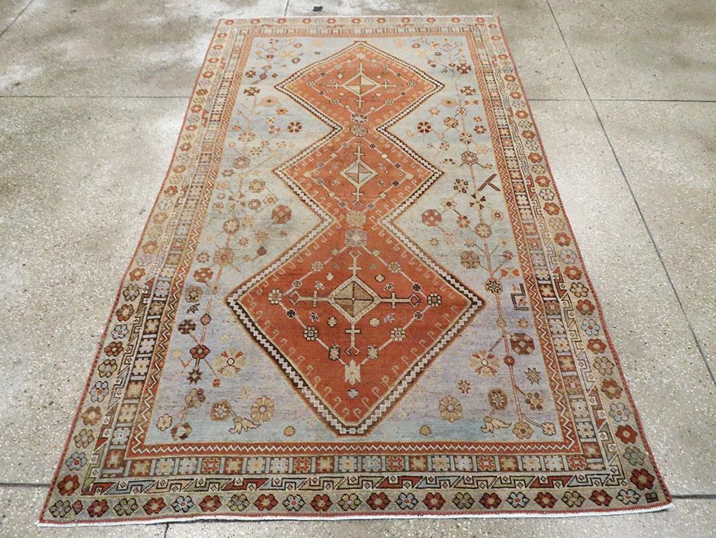 A vintage Persian Shiraz accent rug handmade during the Mid-20th century.

Measures: 4' 10