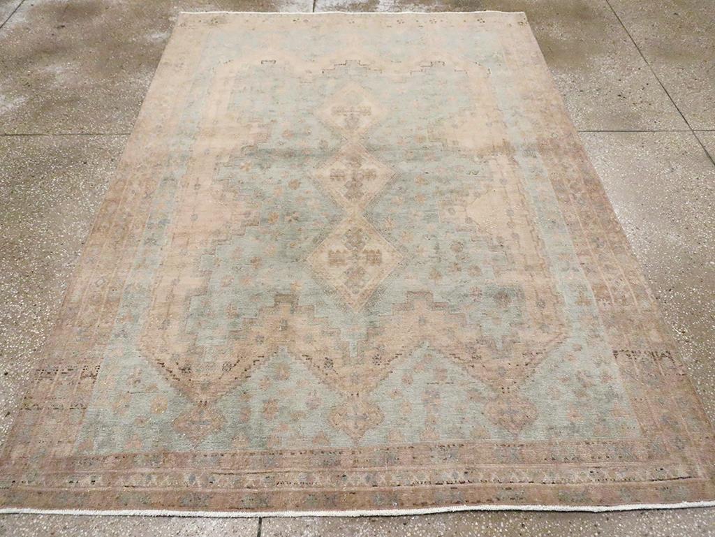 A vintage Persian Shiraz accent rug handmade during the Mid-20th century.

Measures: 5' 4