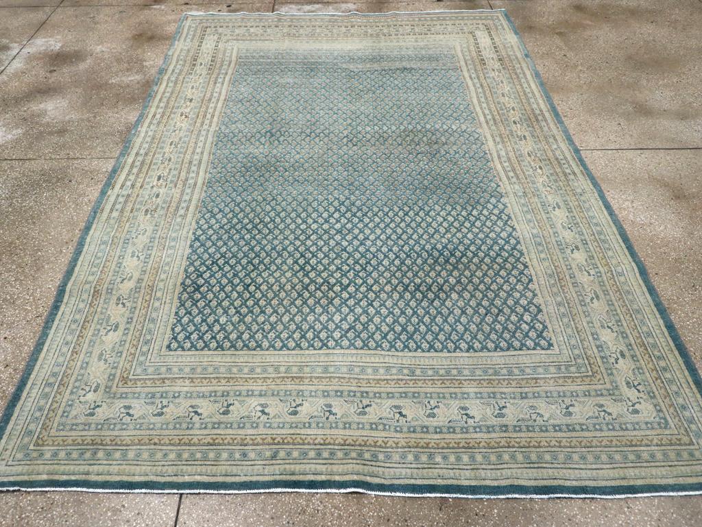 A wool pile of symmetric knots on a cotton foundation. Instead of 8’ by 10’, the 7’ by 10’ size is popular in Mid-Eastern rooms. This city piece shows tiny, offset and row-reversing botehs on a slate/charcoal ground. Count the botehs at your