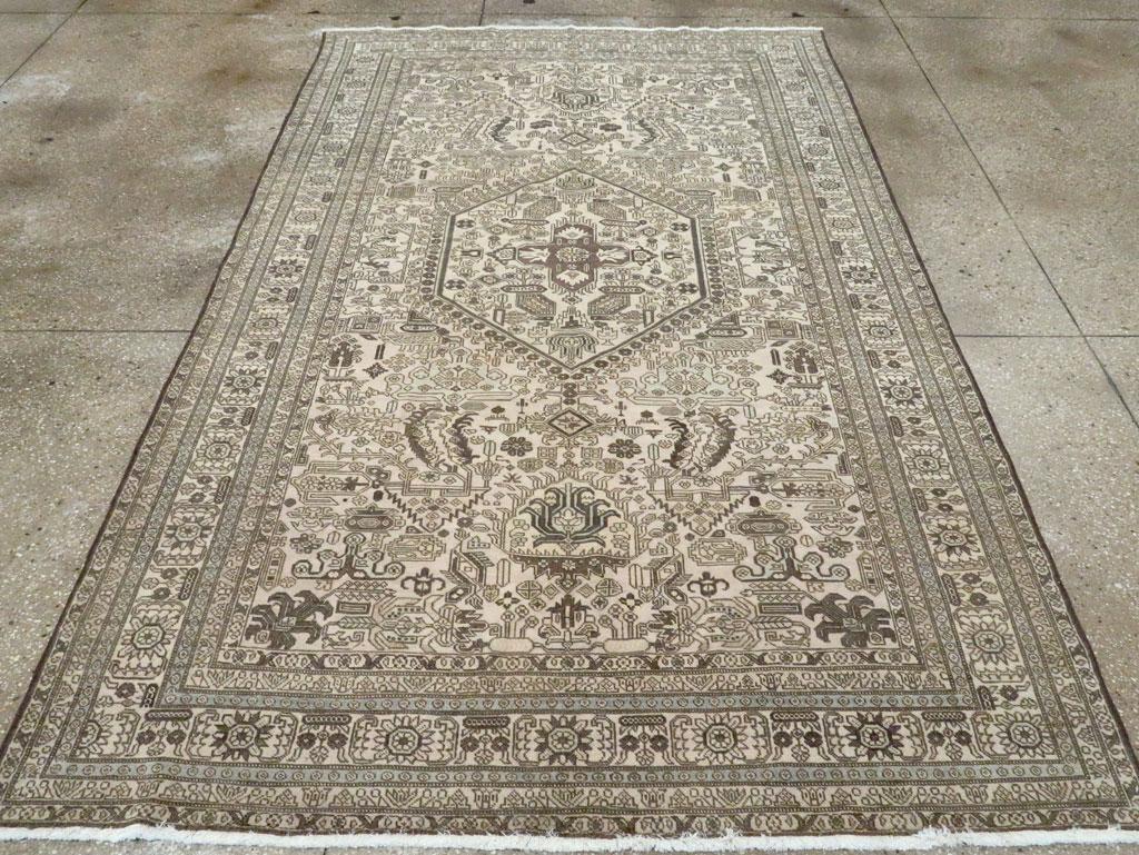 A vintage Persian Tabriz accent rug handmade during the Mid-20th century.

Measures: 5' 5