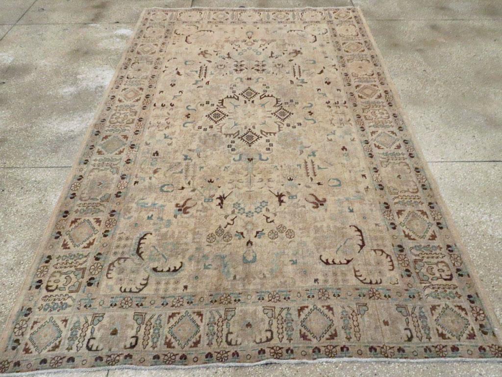 A vintage Persian Tabriz accent rug handmade during the Mid-20th century.

Measures: 6' 3