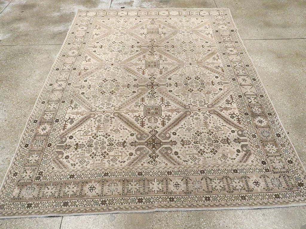 This light palette urban well-woven carpet shows a large diamond lattice pattern deriving from Caucasian Zeychur rugs, but expanded into a larger scale, with barbed diagonal leaves and a scatter of small filler elements. A central series of squares