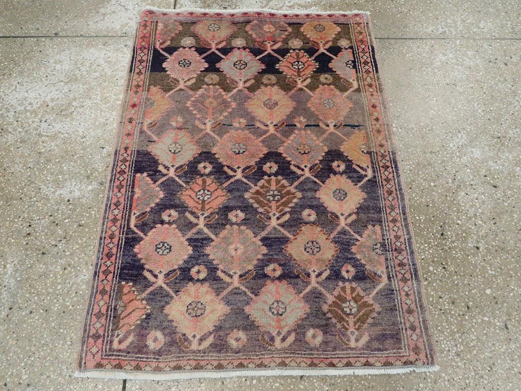 A vintage Persian Tabriz throw rug handmade during the Mid-20th century.

Measures: 2' 4