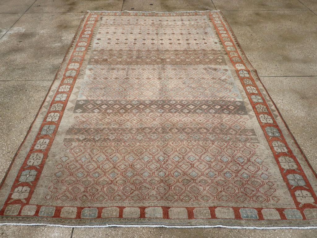 A wool pile of asymmetric knots on a cotton foundation.
No medallion, no pendants, no hooked corners, but it still is a Veece production with a small lattice pattern on a panel abrashed field of pale blue and light brown. The rust border includes