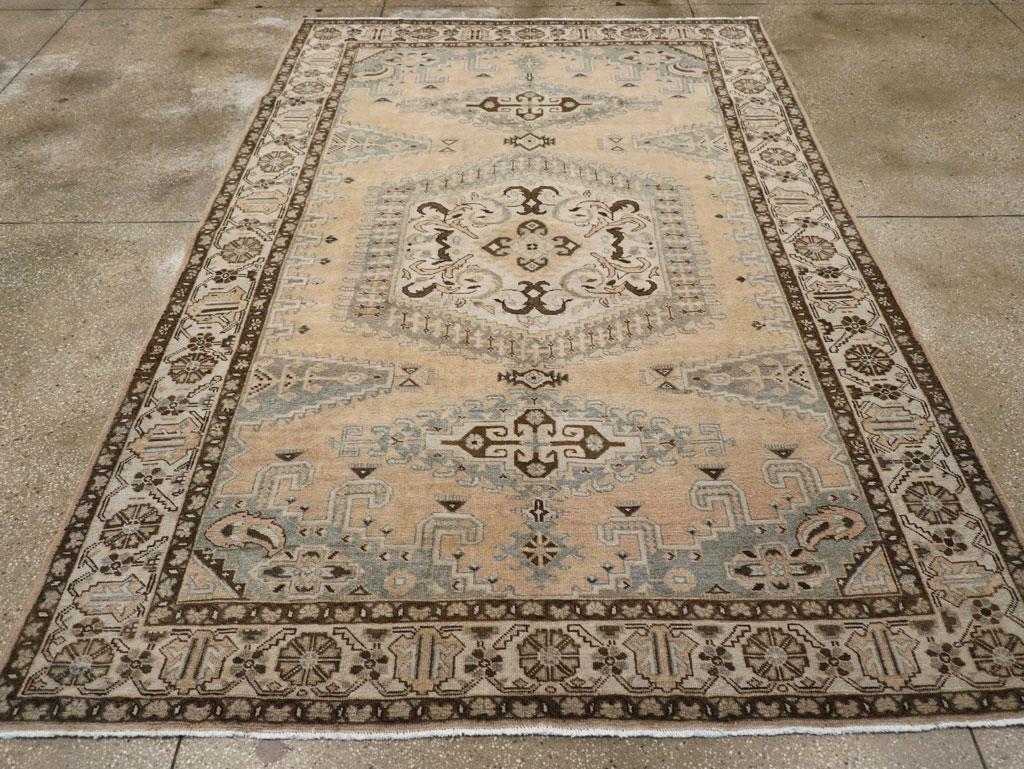 A wool pile of asymmetric knots on a cotton foundation. Veece rugs are a very specialized taste, but some real treasures can be found on this interface of the rustic and the urban. Here a straw field is dominated by a cream hexagonal medallion with