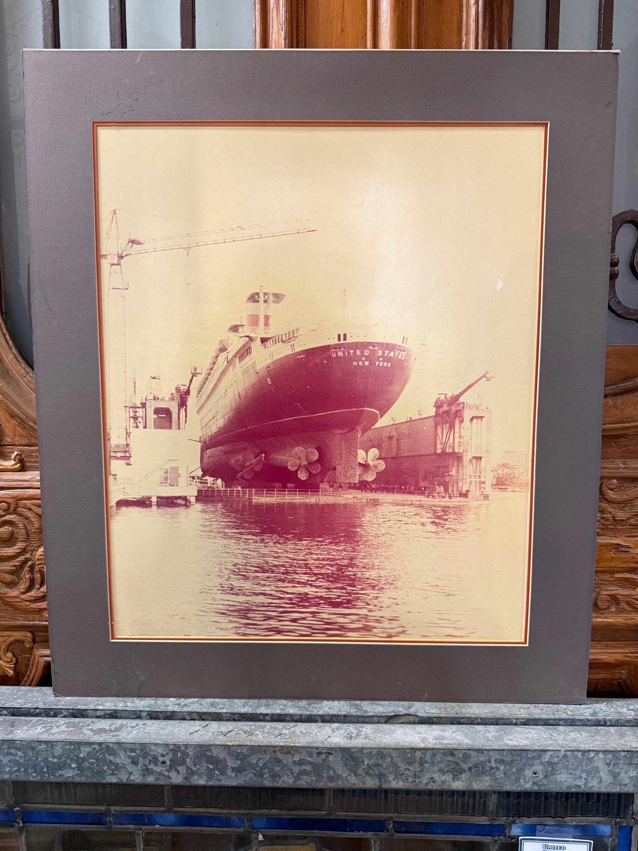 Mid 20th Century photo of the SS United States in dry dock. The SS United States was a luxury passenger liner built in 1952
for the United States Lines. It was designed to be the fastest
passenger ship in the world, a title it achieved on its