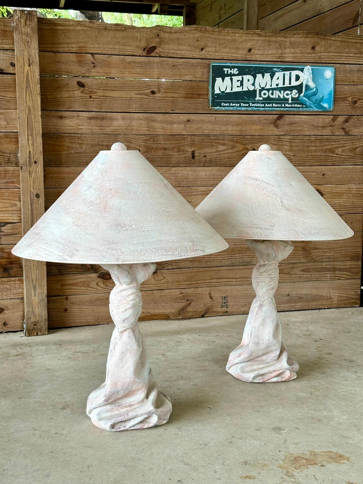 Presenting a fabulous pair of vintage plaster draped knotted tables, complete with their original lampshades and finials, all in vibrant Boho pastel colors. These pieces are attributed to the style of John Dickinson, known for his distinctive and