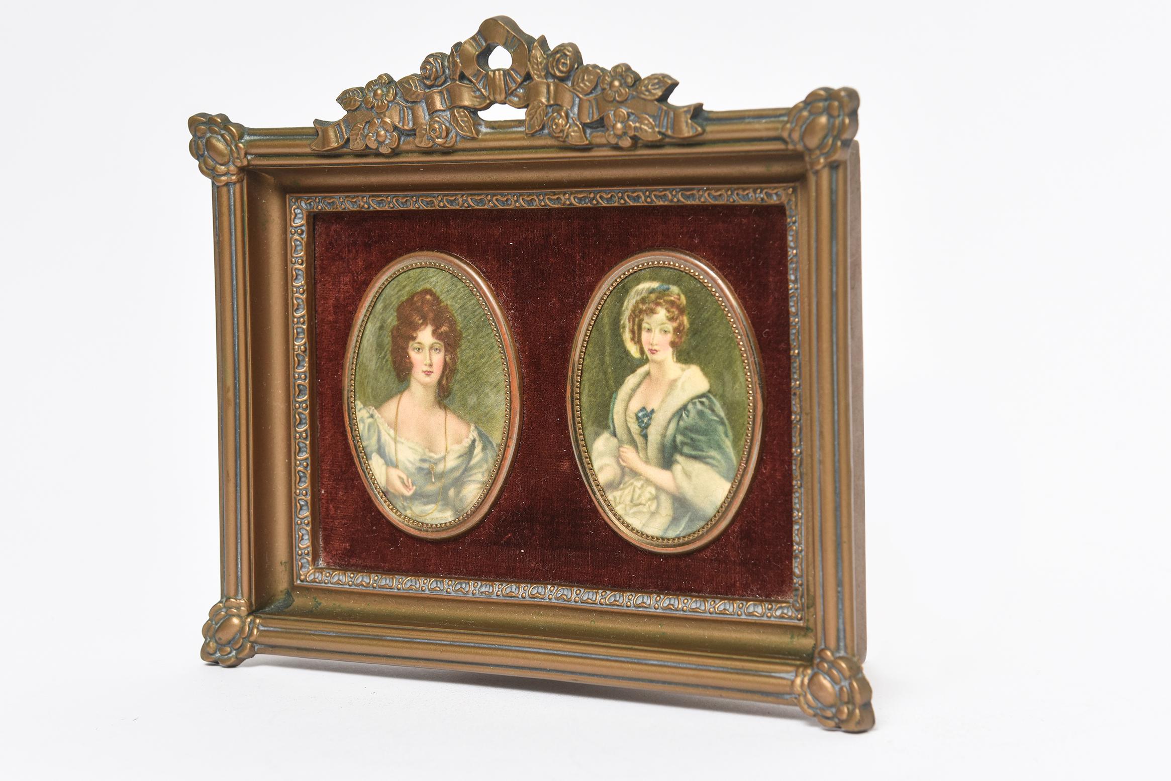This floral gold resin frame features replicas of famous prints of Mary by C.E. Leslie R.A. and Mrs. Croker by Sir Thomas Lawerence set on a burgundy velvet backdrop.
