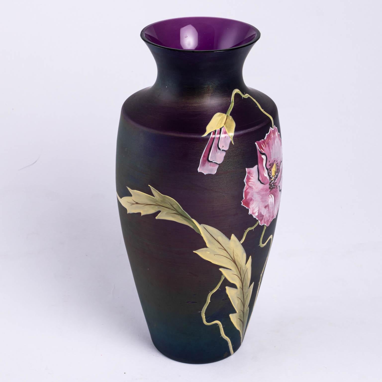 Enameled vase with purple flower and leaves that run around the sides and back, circa mid-20th century. Please note of wear consistent with age including small nicks and scratches.