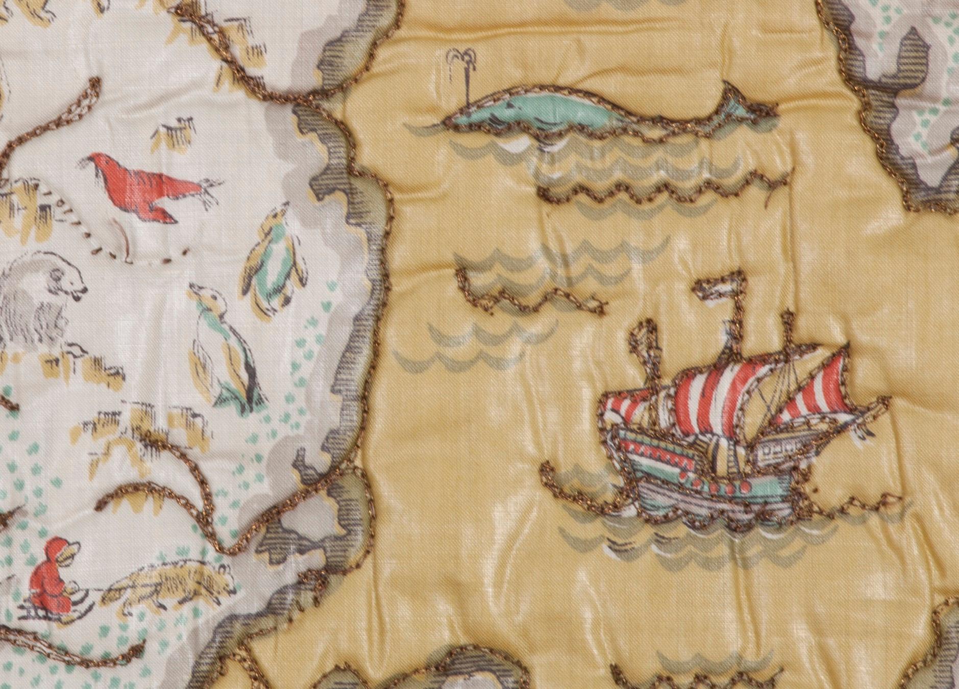 A very charming mid-20th century illustrated map printed on glazed cotton. Some outlines enlivened with couched metallic thread embroidery. The entire piece is edged with woven metallic ribbon (likely woven earlier, circa 19th century). This same