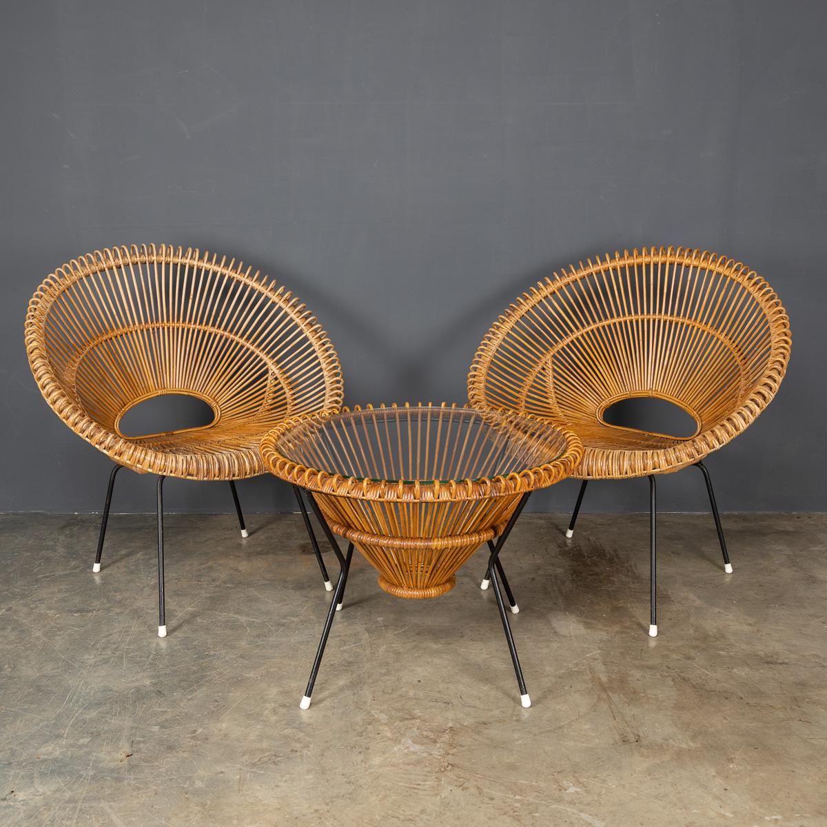 Stylish 20th Century rattan table and chairs by Janine Abraham and Dirk Jan Rol, made in the 1960's, with metal frames, rattan and glass topped table.

CONDITION
In Great Condition - wear as expected.

SIZE
TABLE
Diameter: 59cm
Height: