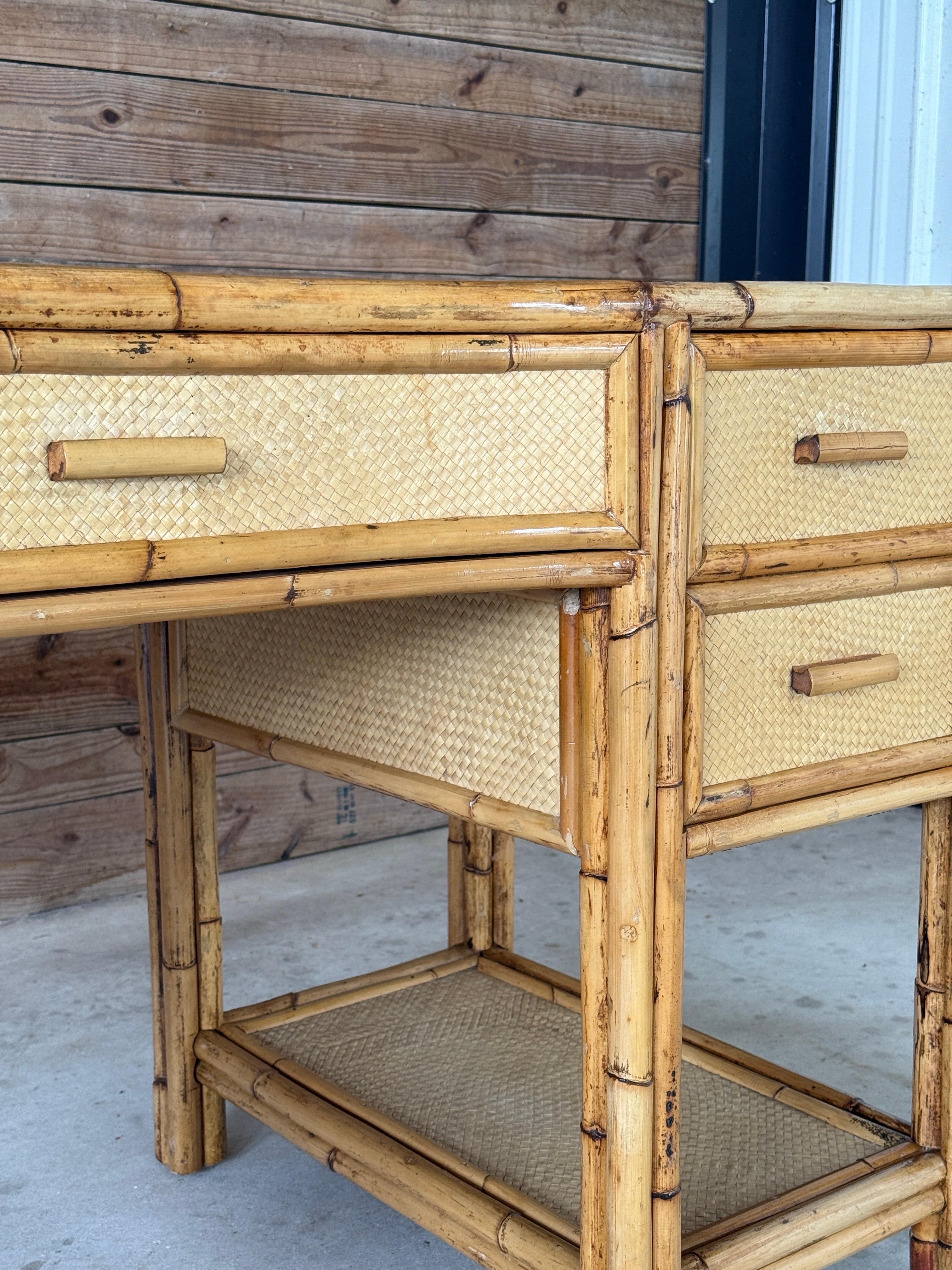 A beautiful Mid-20th Century rattan writing desk showcasing a true balance of coastal charm and British Colonial craftsmanship. The rattan frame has been fully refinished, while the woven panels were left in their original state to retain an