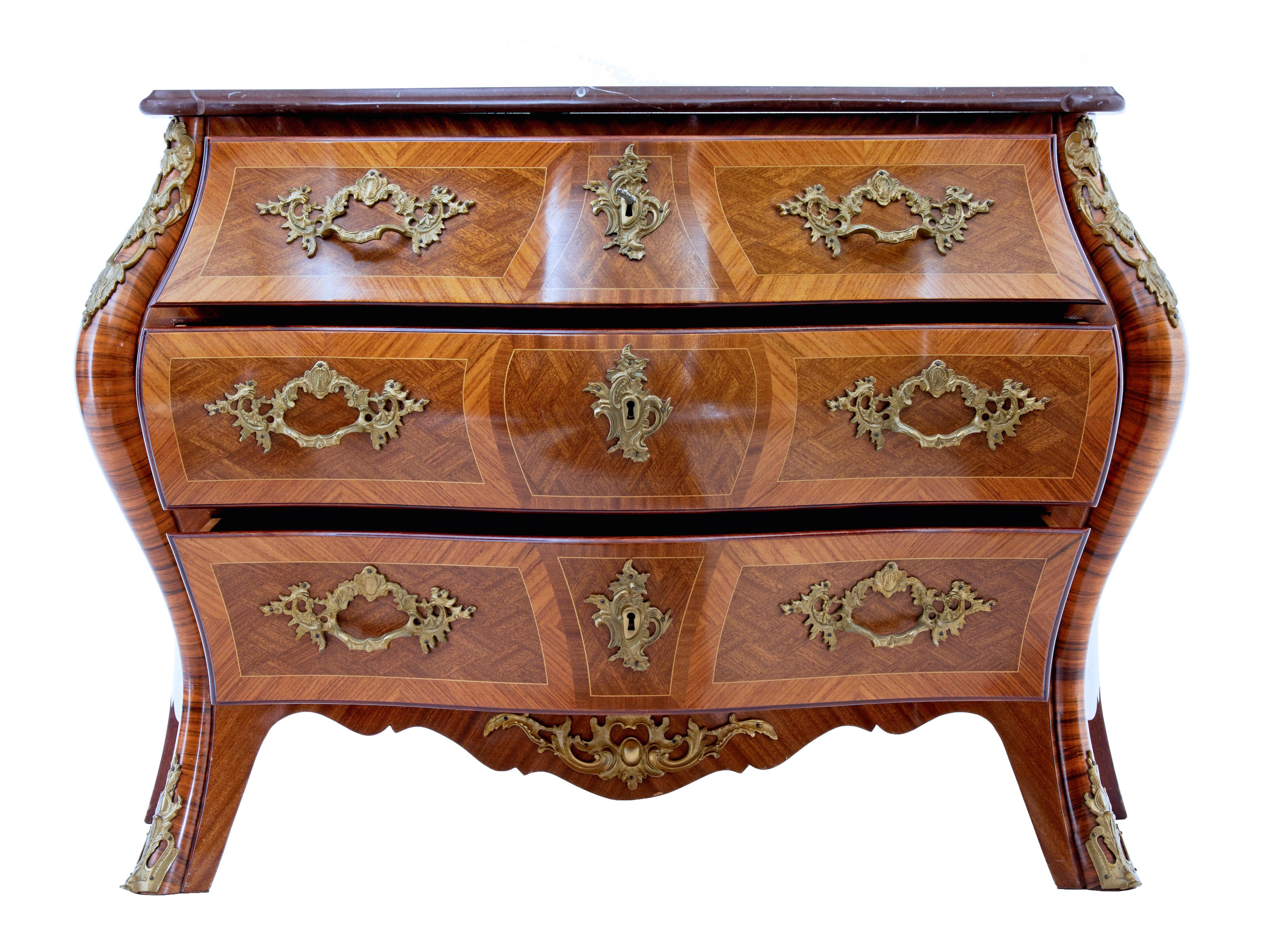 Mid 20th century rococo revival bombe kingwood mahogany chest of drawers circa 1960.

Excellent quality commode by A.B Rococo Mobler. Beautifully bombe shaped marble top commode.

Veneered using mahogany, walnut, satinwood and kingwood.