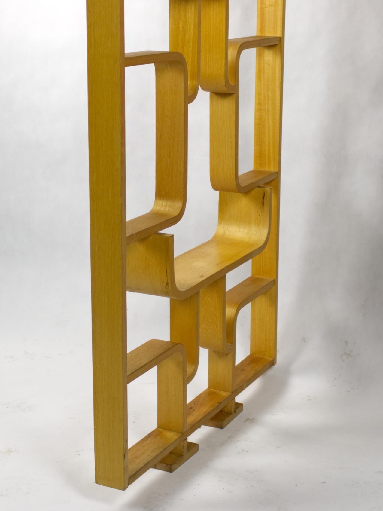 Midcentury wall divider designed by Czech architect, Ludvik Volak and produced by Drevopodnik Holešov in the former Czechoslovakia in the 1960s, made of the bent beech plywood and features geometric patterns. In a good original condition.