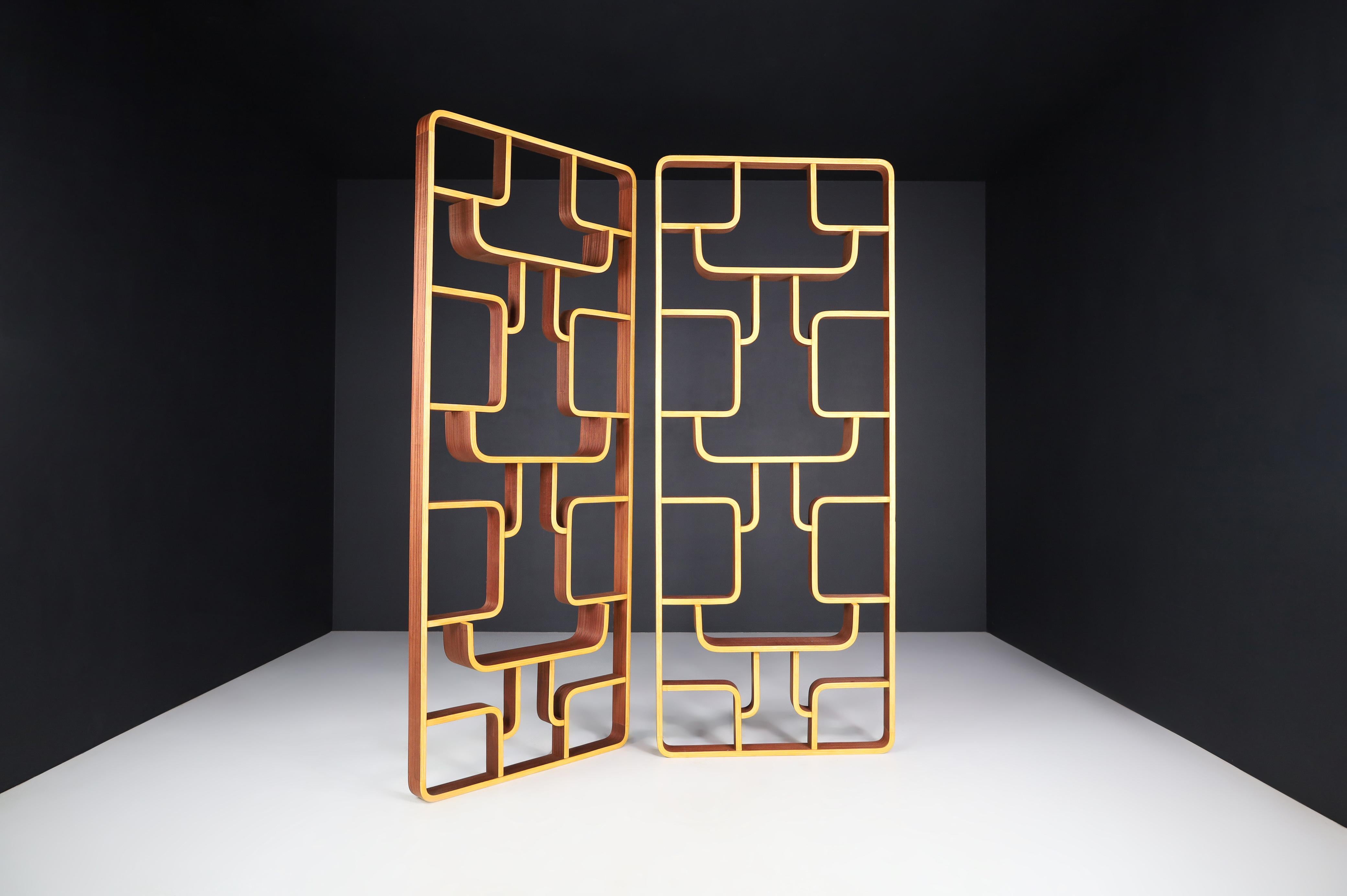 Mid-century room dividers in Bent-Wood by Ludvik Volak, Prague 1960s.

We have acquired a memorable room divider from a villa in Prague that can be used as a wall-mounted shelving unit or room divider. The piece features round edges in blond color