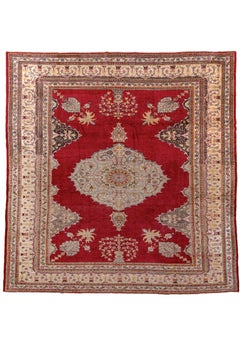 Mid 20th Century Ruby Red Oushak with Center Medallion