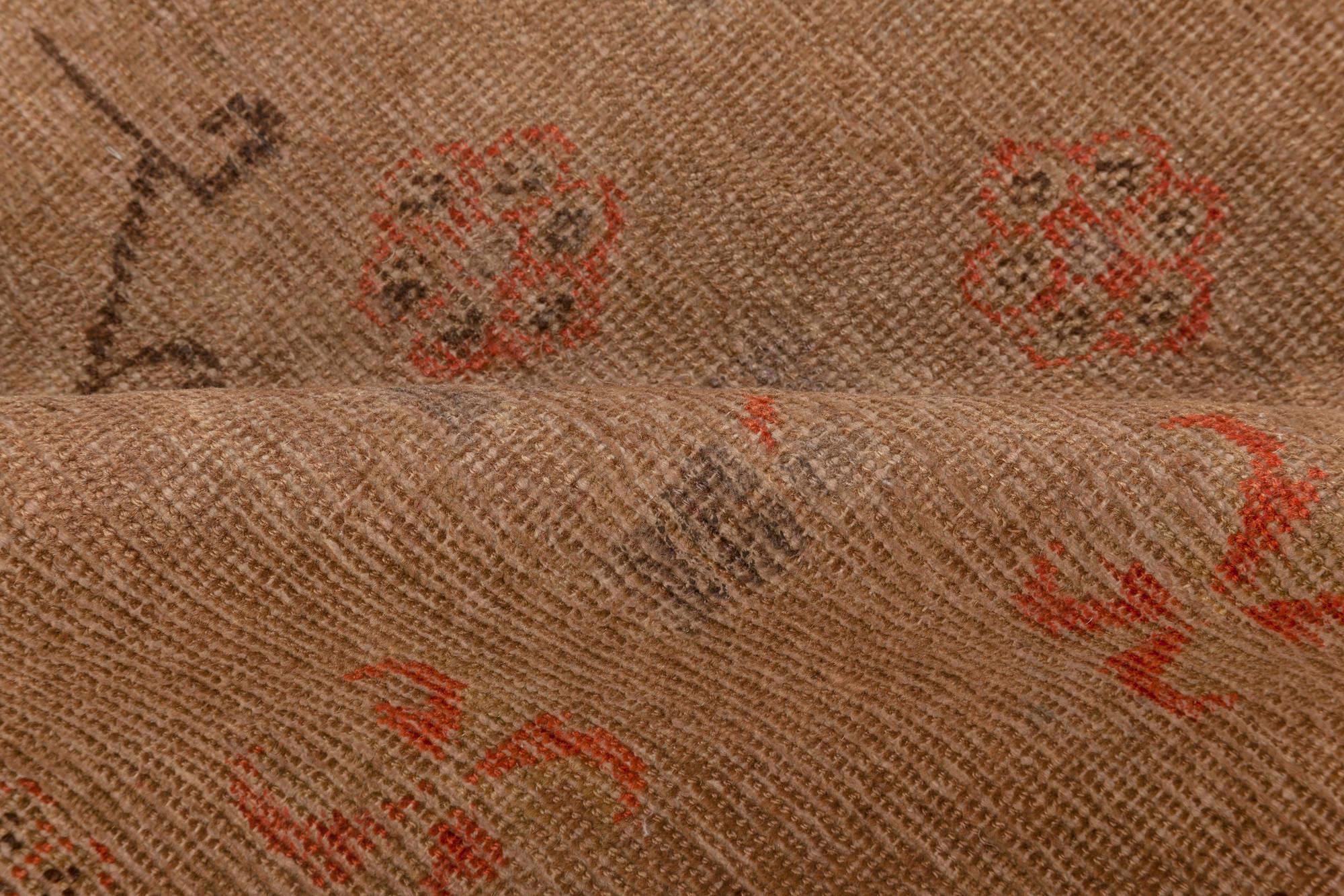 Mid-20th century Samarkand brown, orange, purple handmade wool rug.
Size: 4'9