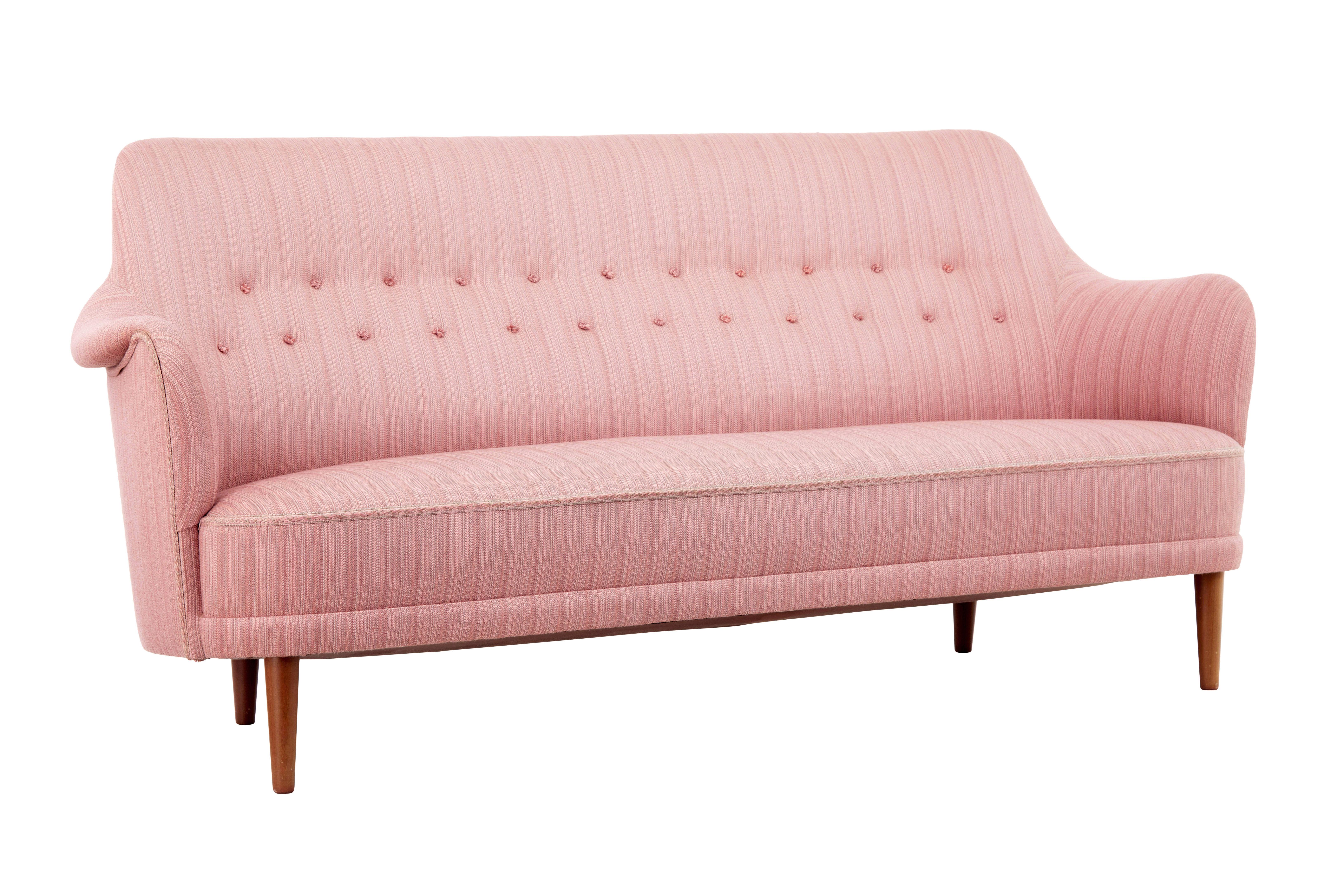 Mid 20th century samsa rund triple sofa by carl malmsten circa 1960.

Well known model of sofa designed by carl malmsten, this sofa is a 3 seater.

Shaped back and arms, with tufted button back detailing to the back rest.  Standing on teak tapering