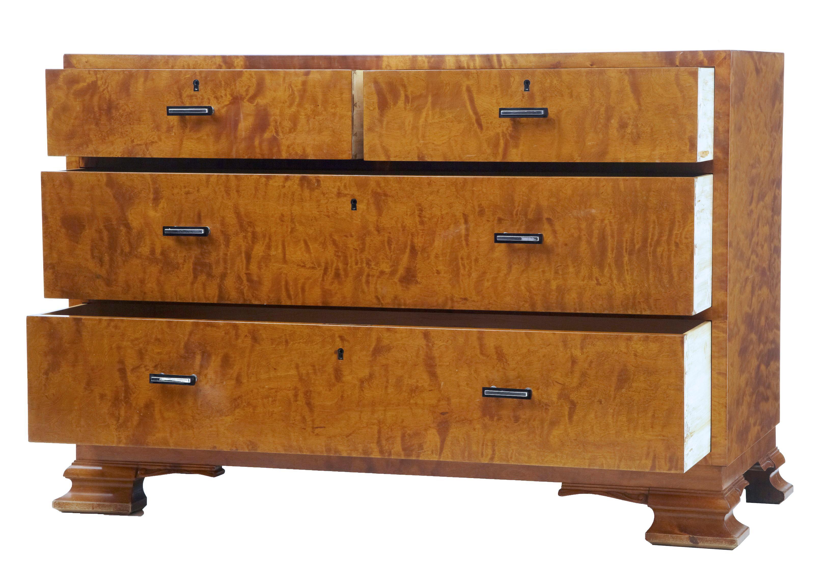 Mid-20th century Scandinavian birch chest of drawers circa 1950.

Good quality Art Deco inspired chest of drawers from Sweden. Fitted with 4 graduating drawers fitted with bakelite and steel handles, 2 over 2 drawer formation. 
Rich color and