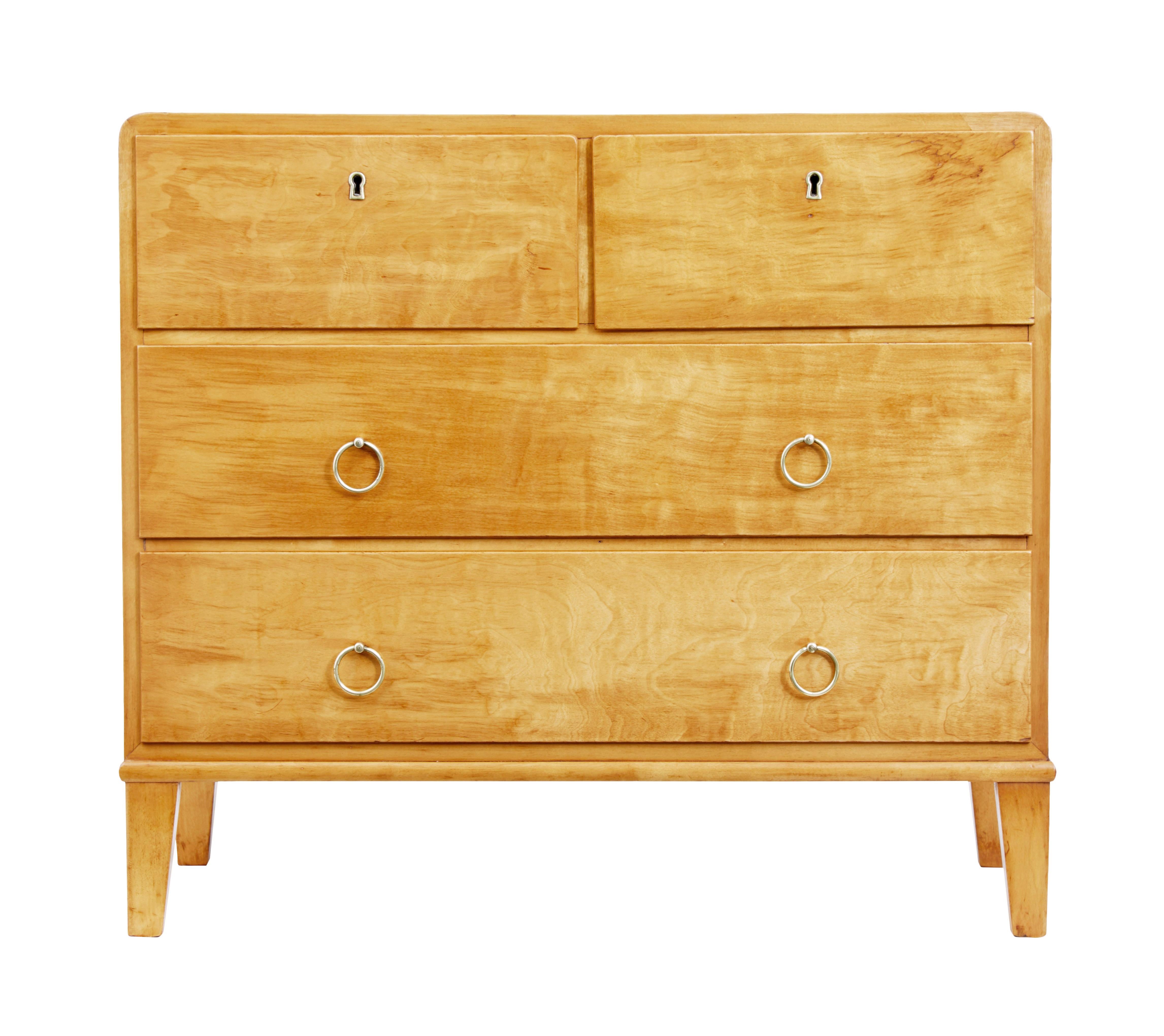 Mid 20th century Scandinavian birch chest of drawers circa 1950.

Stylish chest of drawers of small proportions, rounded top edges in the art deco taste, 2 short drawers over 2 long.  Top 2 drawers open on the key, bottom drawers with brass ring