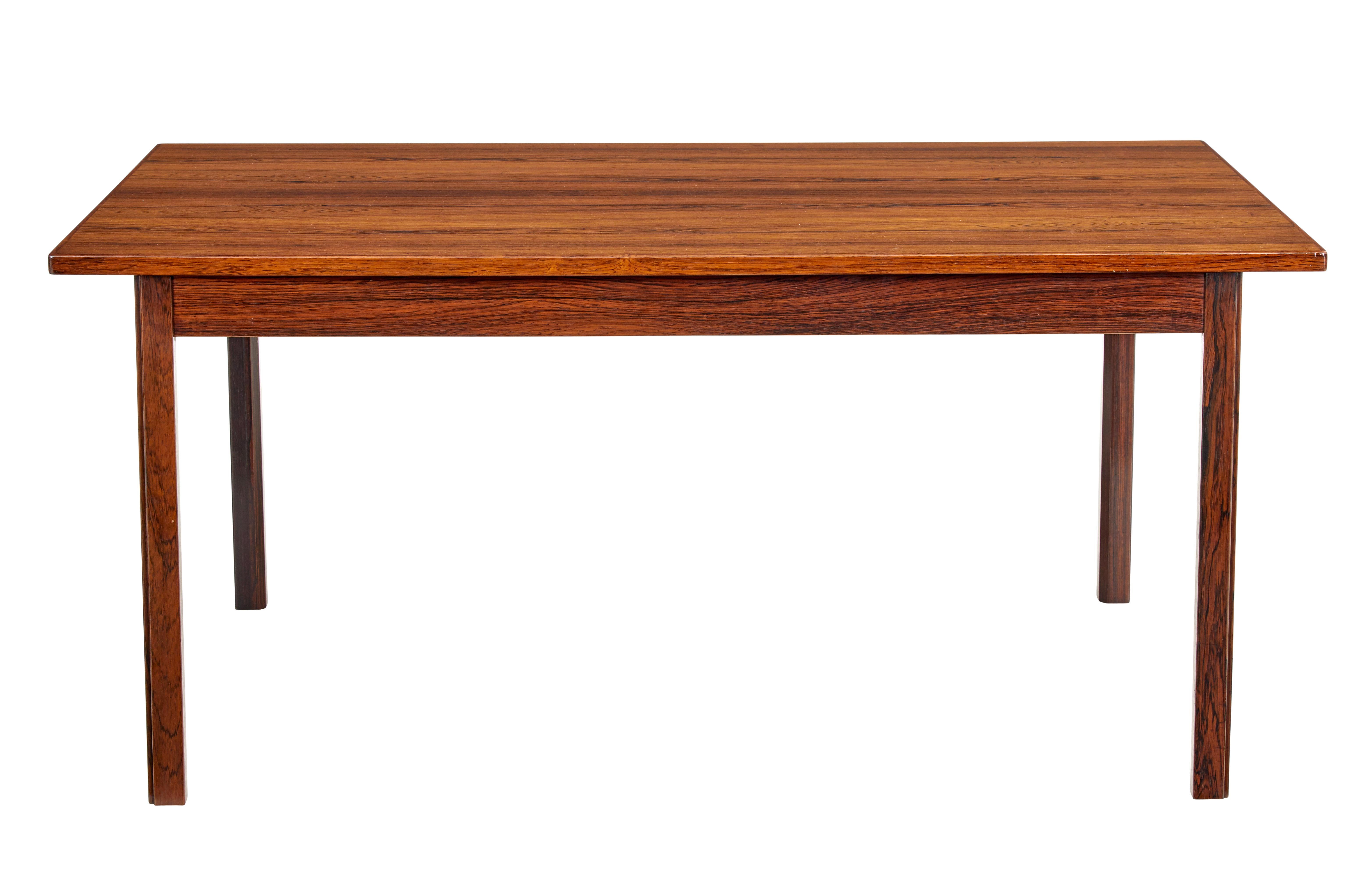 Mid-20th century Scandinavian coffee table circa 1970.

Danish made coffee table veneered in palisander. Slightly over sailing top, standing on straight legs.

Minor surface marks from use, recently re-polished and ready for everyday