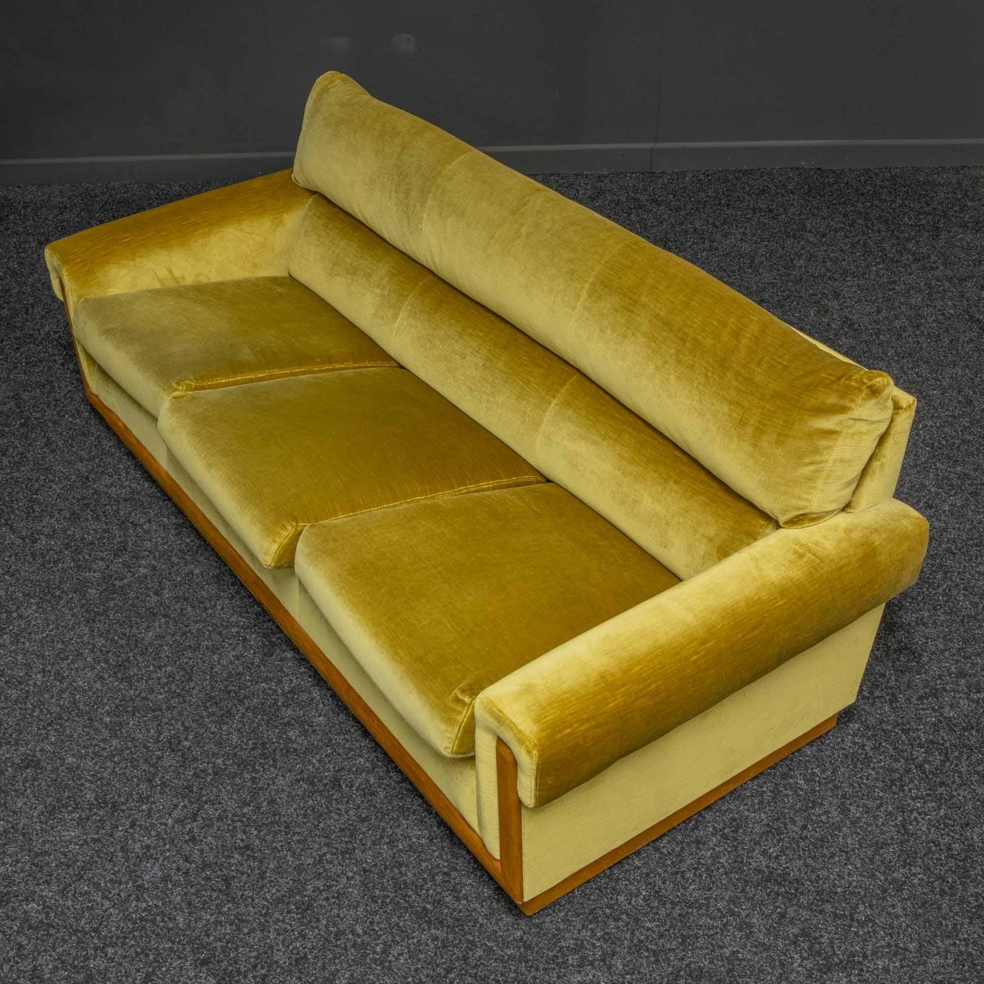 A fantastic mid-20th century four piece suite of Scandinavian manufacture. The main exposed frame is teak and the covering is the original gold Draylon (velvet). The four-seat settee is unusually large at 247cm = 97 inches long. The three-seat