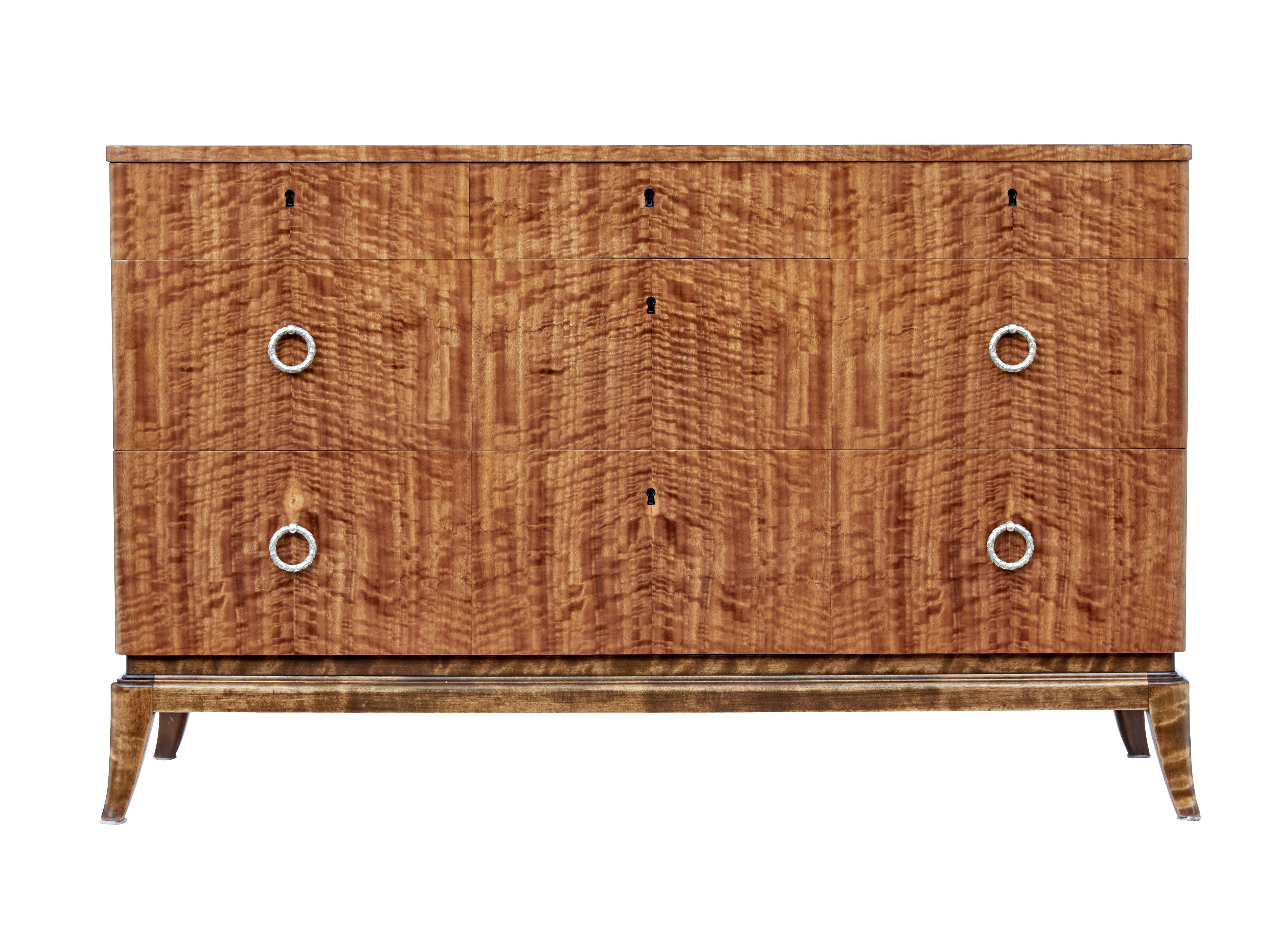 Mid-20th century Scandinavian satinwood chest of drawers, circa 1960.

Excellent quality Swedish chest of drawers, veneered in striking satinwood. Fitted with 3 graduating drawers, top drawer opens on the key, other drawers fitted with brass