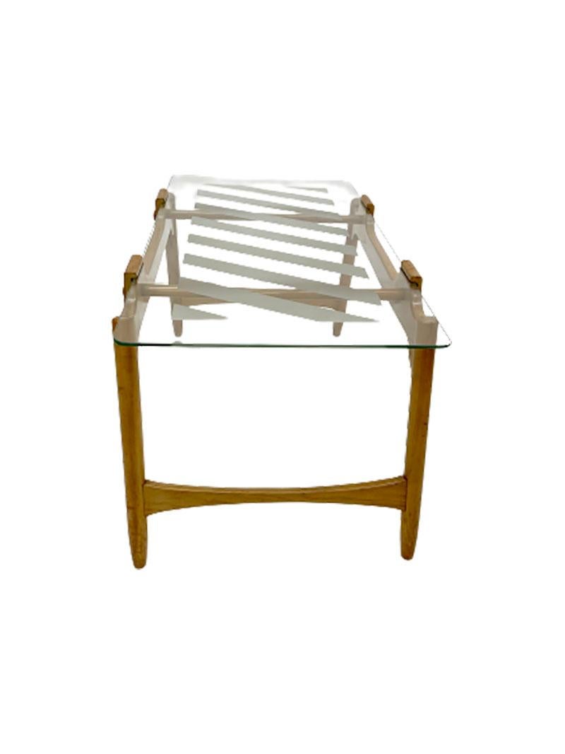 Mid-20th century Scandinavian style coffee table

A beechwood coffee table with striped satin glass top in Scandinavian style
The glass is attached by sliding into a slot of the table
The table shows some age wear
The measurements are 45 cm