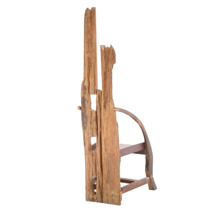 Midcentury sculptural chair. Composed of remains of ancient farming implements. Handmade of olive wood and walnut structure, France, 1940s.



 