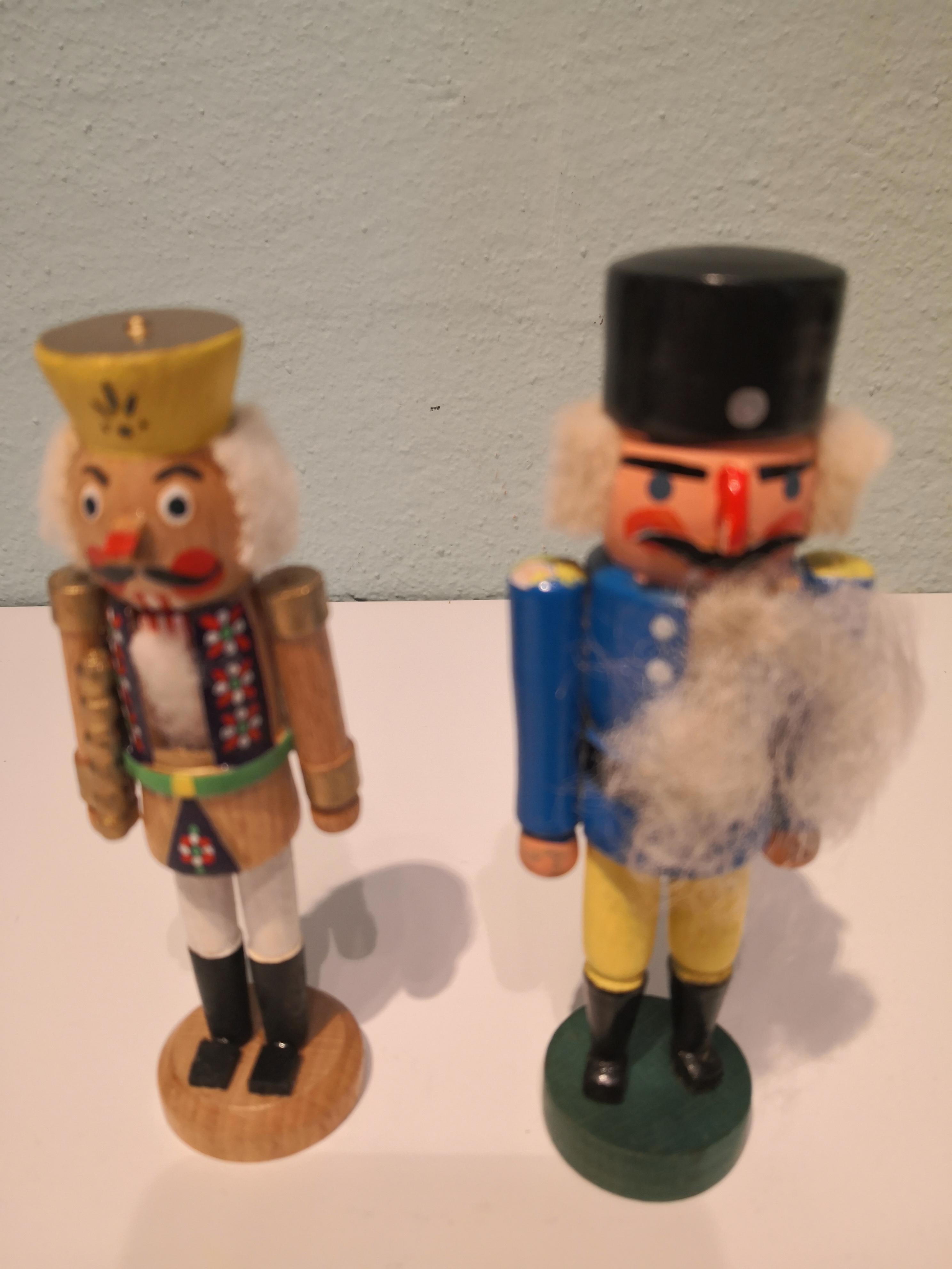 Beautiful hand-colored and hand decorated wooden set of five santa figures nutcrackers from the Erzgebirge Germany in three seizes. The region Erzgebirge formerly Eastern Germany is famous for this special kind of Christmas figures, where intricate