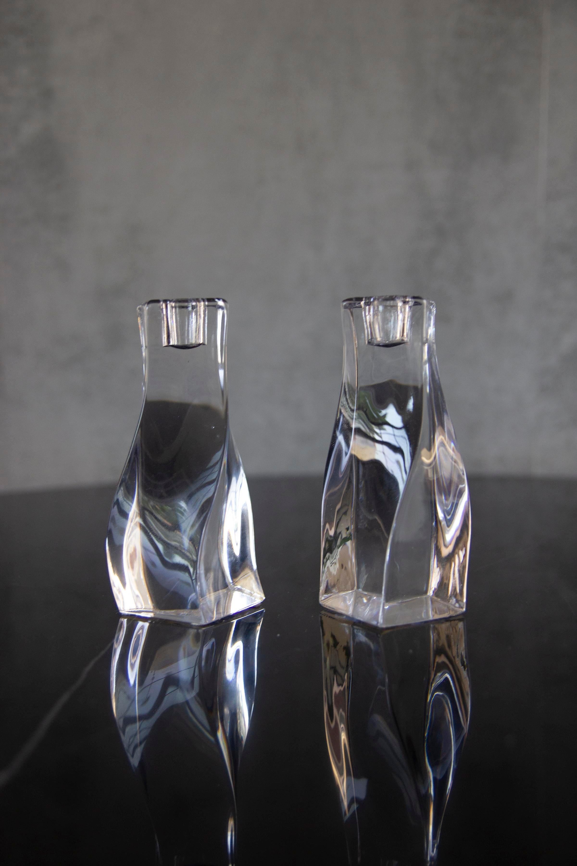 A pair of Mid-Century Modern crystal candlestick holders made by Orrefors unusual twist crystal.
Nice vintage piece for your living space.