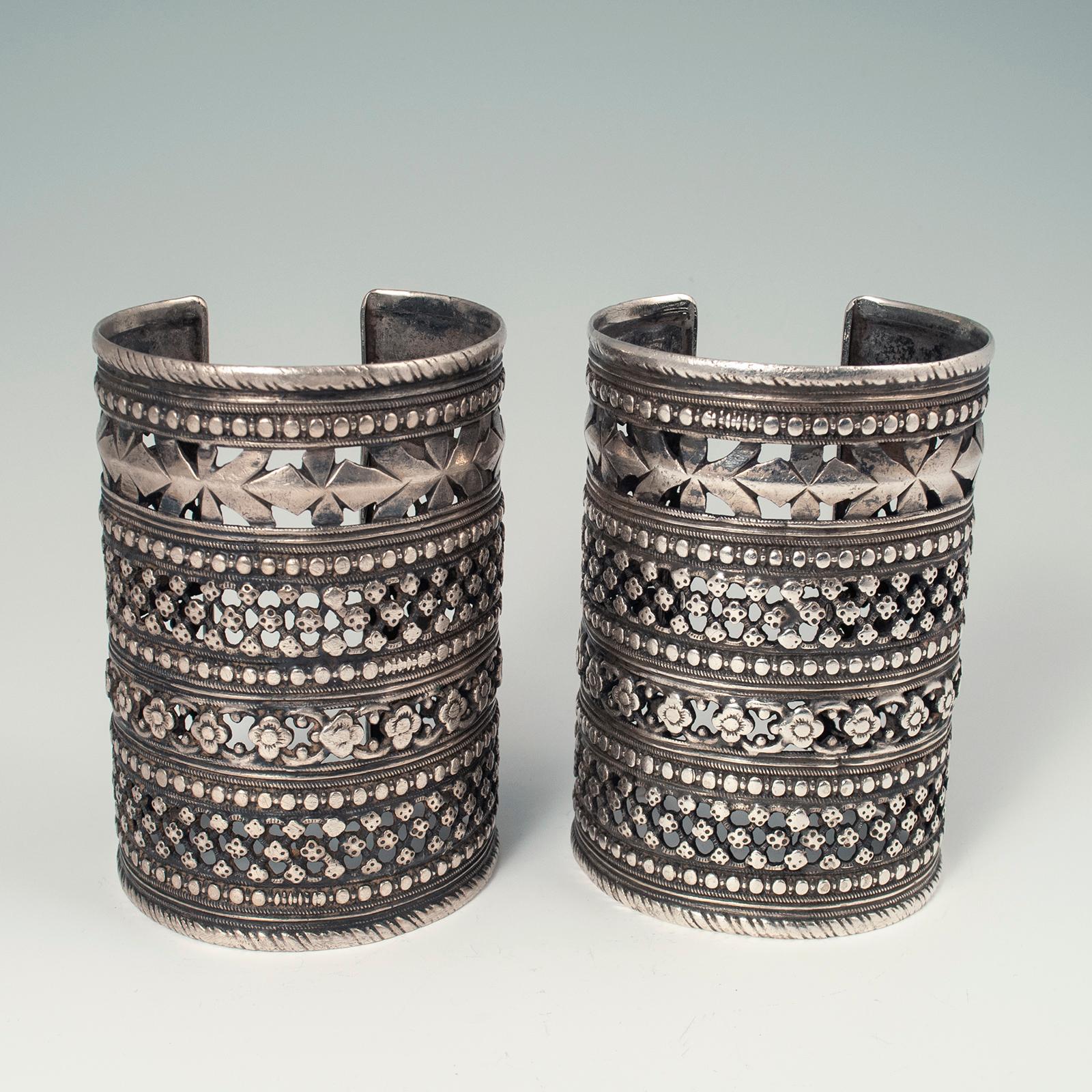 Mid-20th century silver tribal cuffs, Hazara tribe, Afghanistan

A pair of silver cuffs worn by women of the Hazara tribe in Afghanistan. Very good workmanship and condition. Weight is 200 grams each. 8.25 inch interior circumference, 4.25 inches