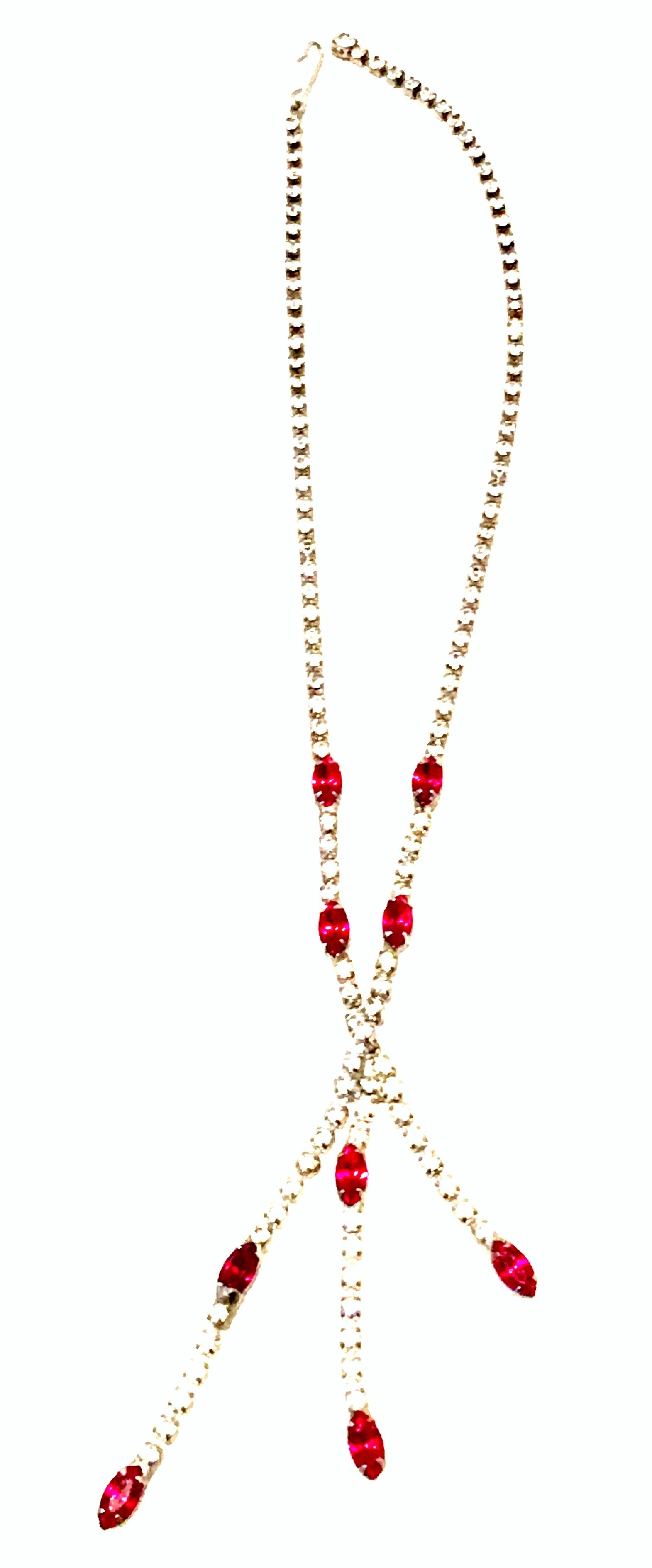 Mid-20th Century Art Deco silver Plate & Austrian Crystal Tassel Drop Necklace. This timeless, classic and sleek choker style necklace features silver plate prong set brilliant cut and faceted colorless and ruby red stones. The longest drop length