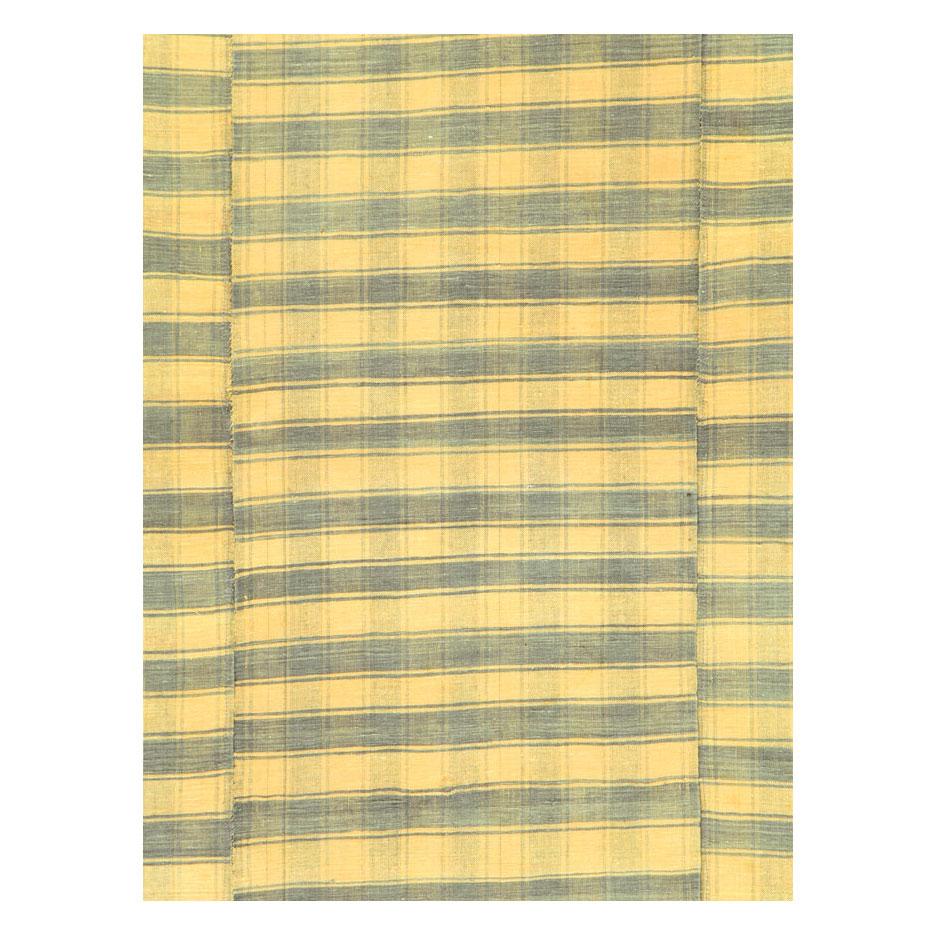 A vintage Turkish flat-weave Kilim small room size accent rug handmade during the mid-20th century with a striped pattern in yellow and silver-grey.

Measures: 5' 8