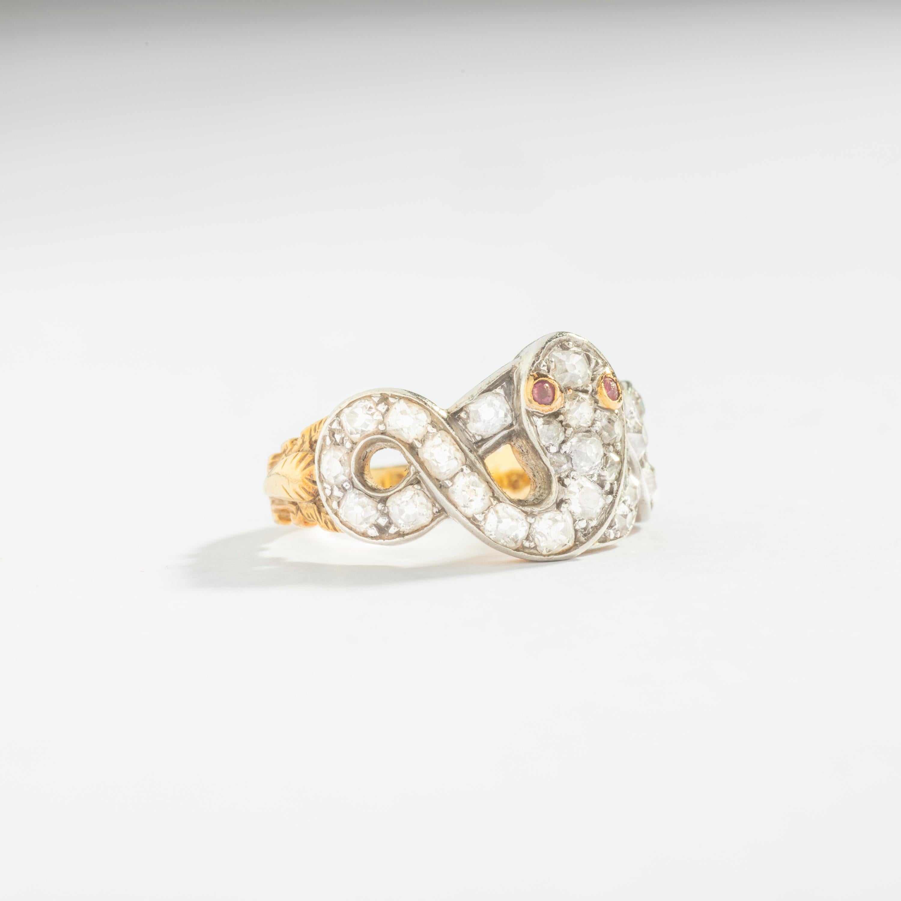 Mid-20th Century 
Snake Diamond with Ruby eyes on Platinum and Yellow Gold 18k Ring.

Ring size: 7.